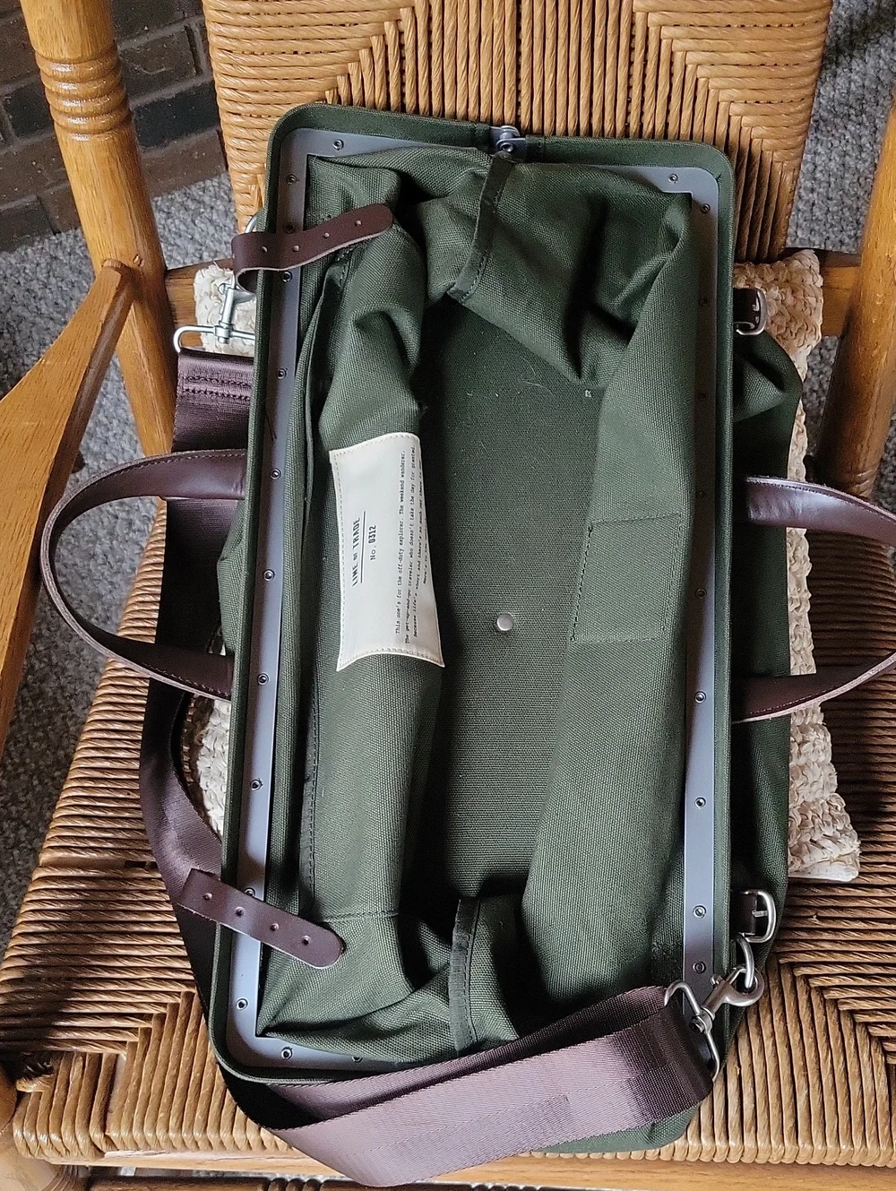 Line of Trade green military duffle sack with brown canvas strap